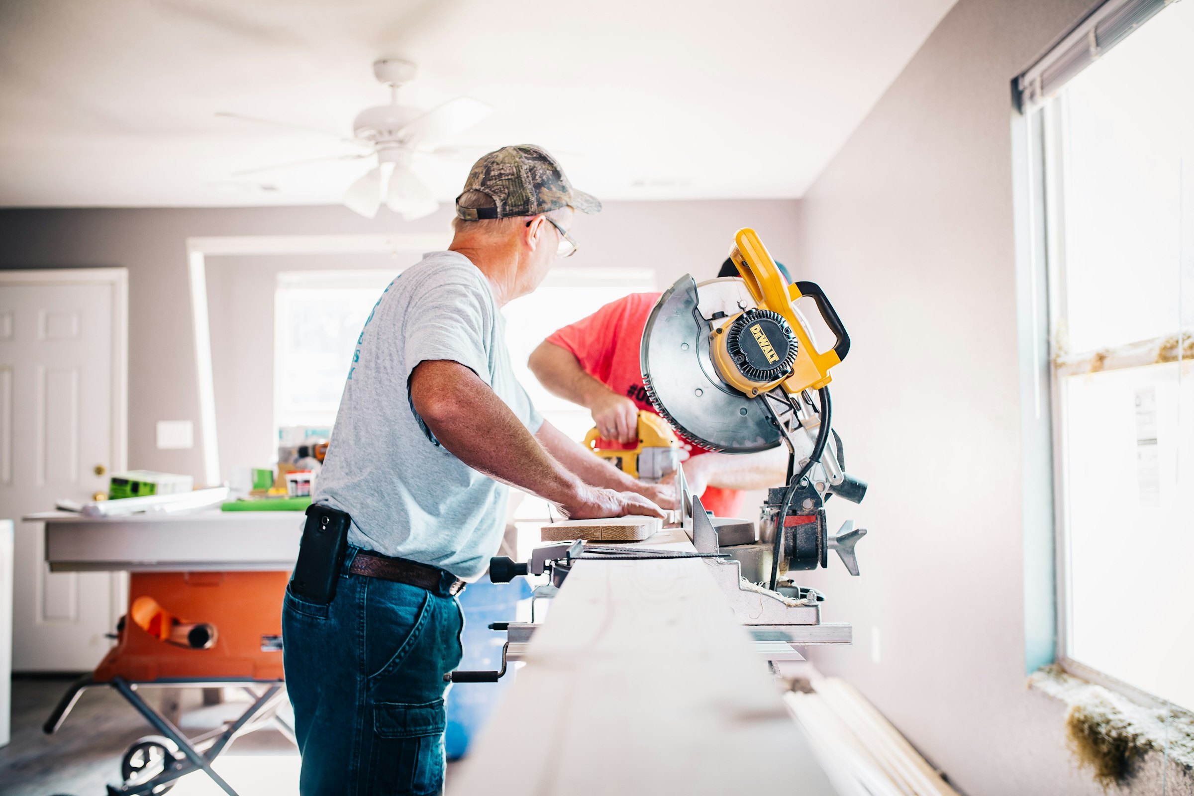 Two contractors working together on a home renovation